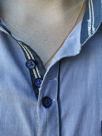 Cropped photo of mans button up shirt