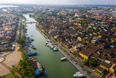 High angle view of river amidst buildings in city