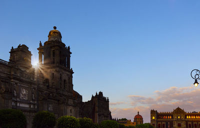 Low angle view of buildings against blue sky