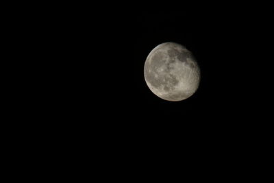 Low angle view of moon against clear sky at night