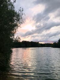 Scenic view of lake against sky during sunset