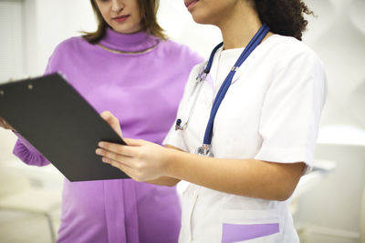 Female doctor using digital tablet