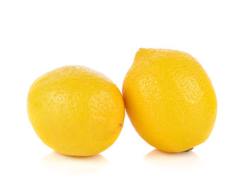 Close-up of oranges against white background