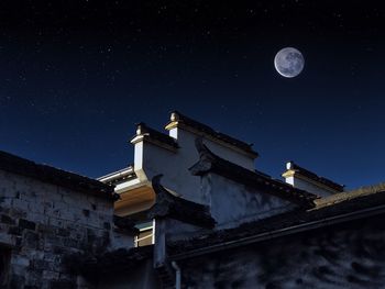 Low angle view of building against sky at night