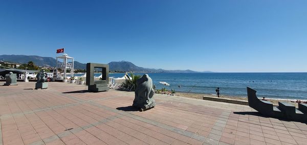 Scenic view of sea against clear blue sky