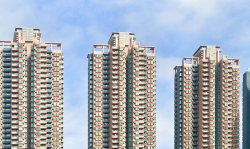 Low angle view of modern buildings against sky