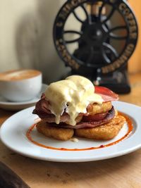 Close-up of breakfast and coffee served on table