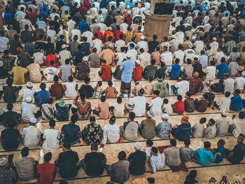 High angle view of people standing against wall