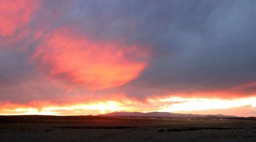 Scenic view of landscape against cloudy sky