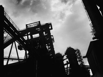 Low angle view of crane against clear sky