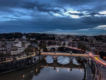 Bridge over river with buildings in background