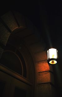 Low angle view of illuminated lamp