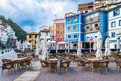 Empty chairs and tables in restaurant