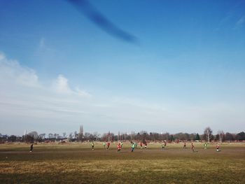 People relaxing on landscape