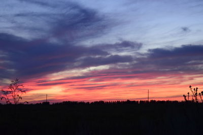Silhouette of landscape against dramatic sky