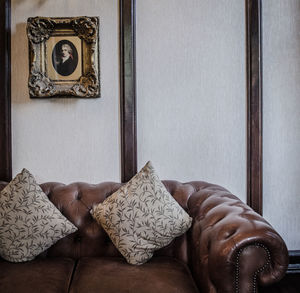 View of cropped leather sofa against the wall