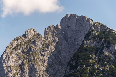 Low angle view of rock formation against sky