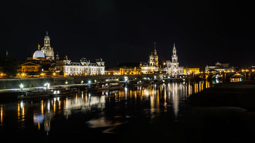 Illuminated city lit up at night