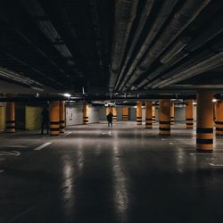 People in empty parking garage