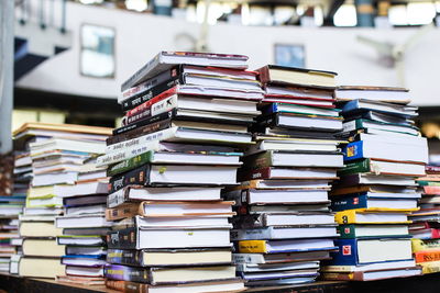 Stack of books on table at library