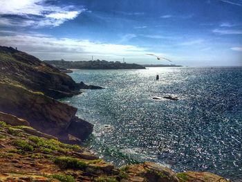 Scenic view of sea against blue sky