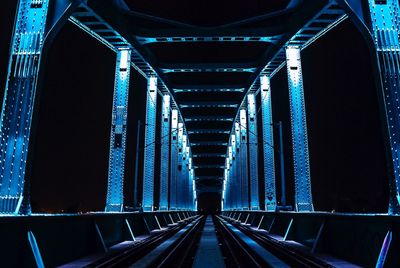 Illuminated bridge at night