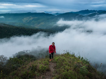 Woman standing on mountain 