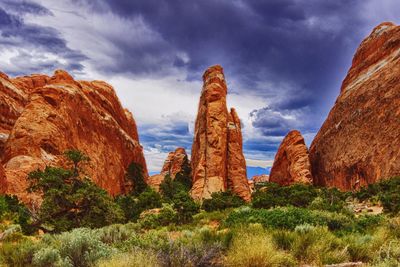 Scenic view of mountains against cloudy sky