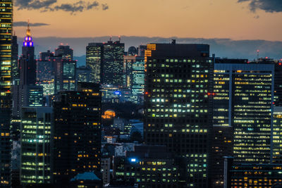 Illuminated buildings in city at night