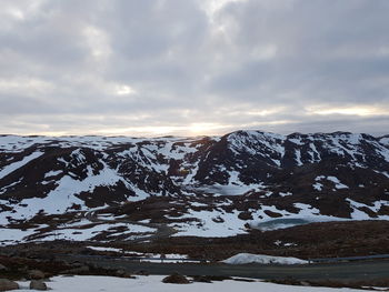 Scenic view of snowcapped mountains against sky during winter