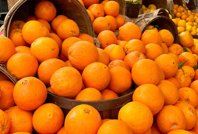 Basket of fresh oranges at farmers market