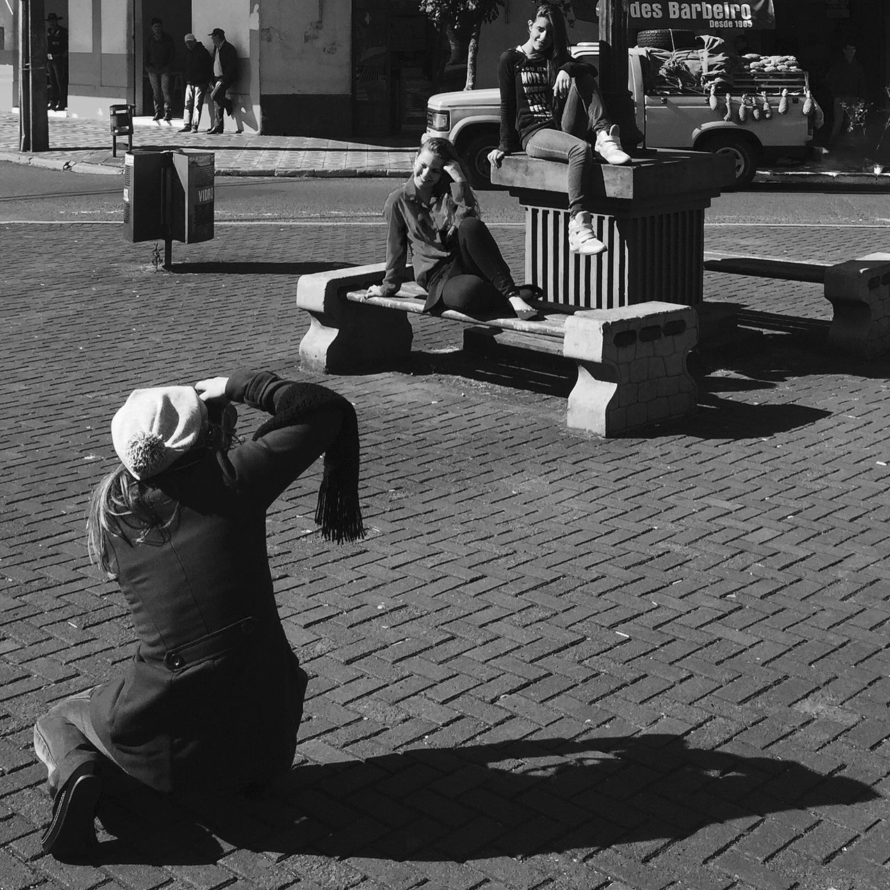 street, lifestyles, sitting, leisure activity, men, full length, building exterior, person, cobblestone, sidewalk, city, incidental people, casual clothing, outdoors, rear view, day, chair, walking