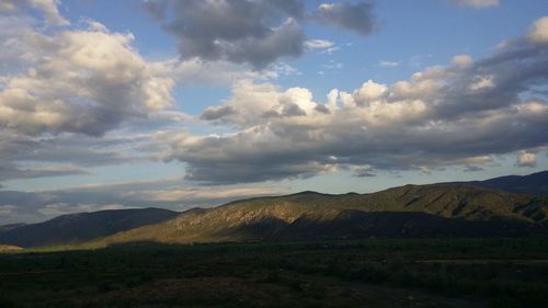 View of landscape against cloudy sky