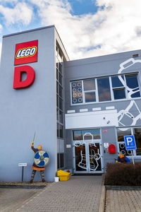 Information sign on building against sky