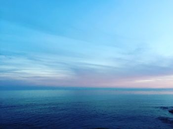 Scenic view of sea against blue sky