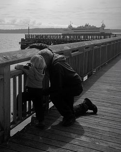 Woman standing on pier