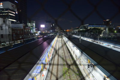 High angle view of railroad tracks at night