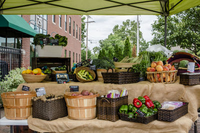 Fruits and vegetables in basket on table