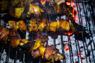 Close-up of autumn leaves on barbecue grill