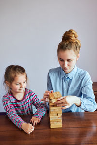 High angle view of friends sitting on table