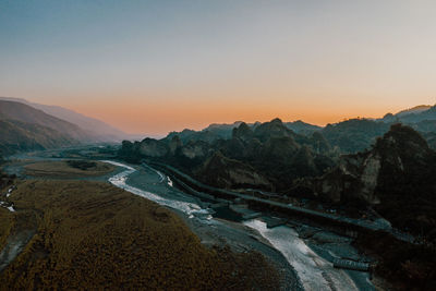 Scenic view of mountains against sky during sunset