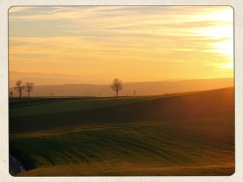 Scenic view of landscape at sunset