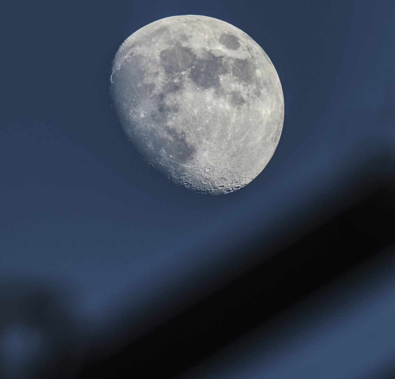 LOW ANGLE VIEW OF MOON IN SKY