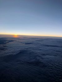 Scenic view of sea against clear sky during sunset