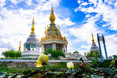 View of temple building against cloudy sky