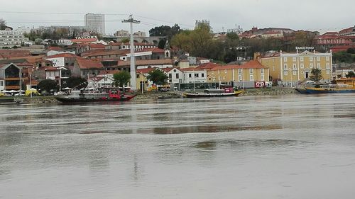 Boats in town against sky