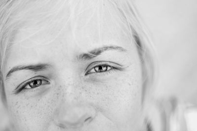 Close-up portrait of a smiling young woman