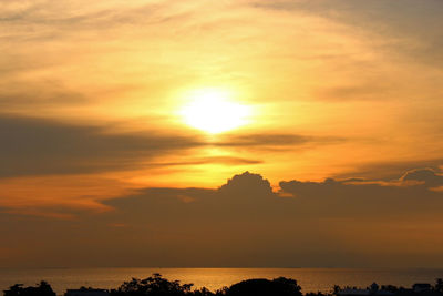 Scenic view of sea against romantic sky at sunset