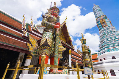 Low angle view of temple against building