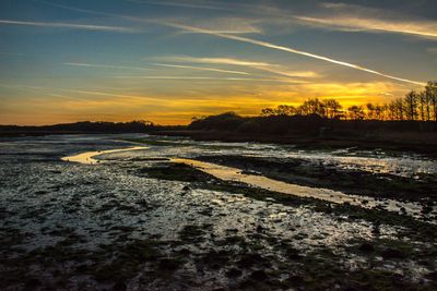 Scenic view of landscape against sky during sunset